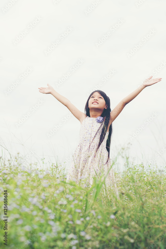 Little girl enjoy with nature on meadow field. Little girl enjoy with nature on meadow field.