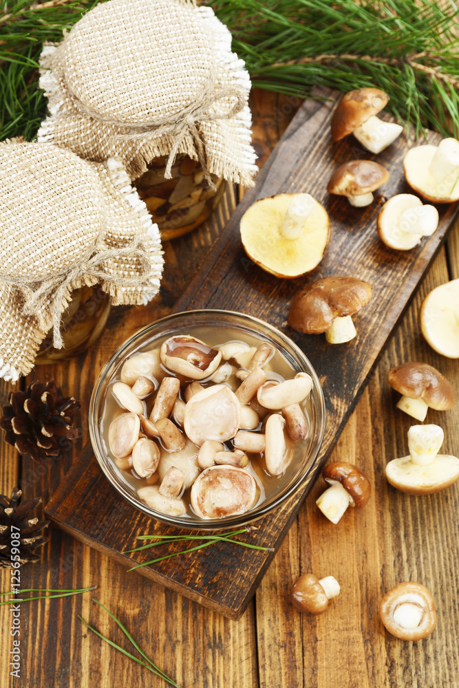 Fototapeta premium Pickled and fresh mushrooms