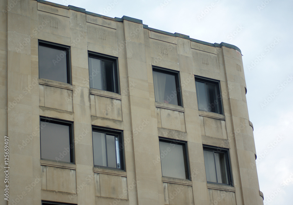 Fototapeta premium beige concrete building habitation or office place downtown