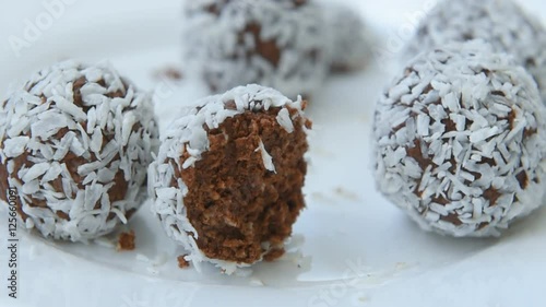 Unsweetened coconut energy bites with cocoa photo