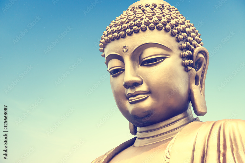 Buddha statue on the blue sky