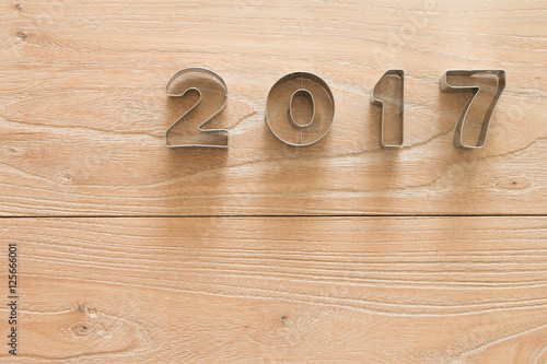 New Year 2017 on a wood background