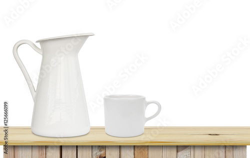 blank milk jug with white cup place on the wood table on white b