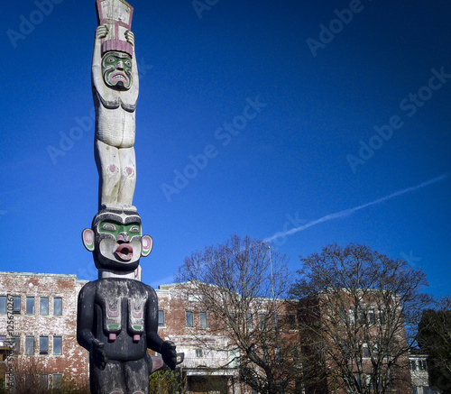 Totem in front of Indian Residential School (abandoned) Alert Bay Canada