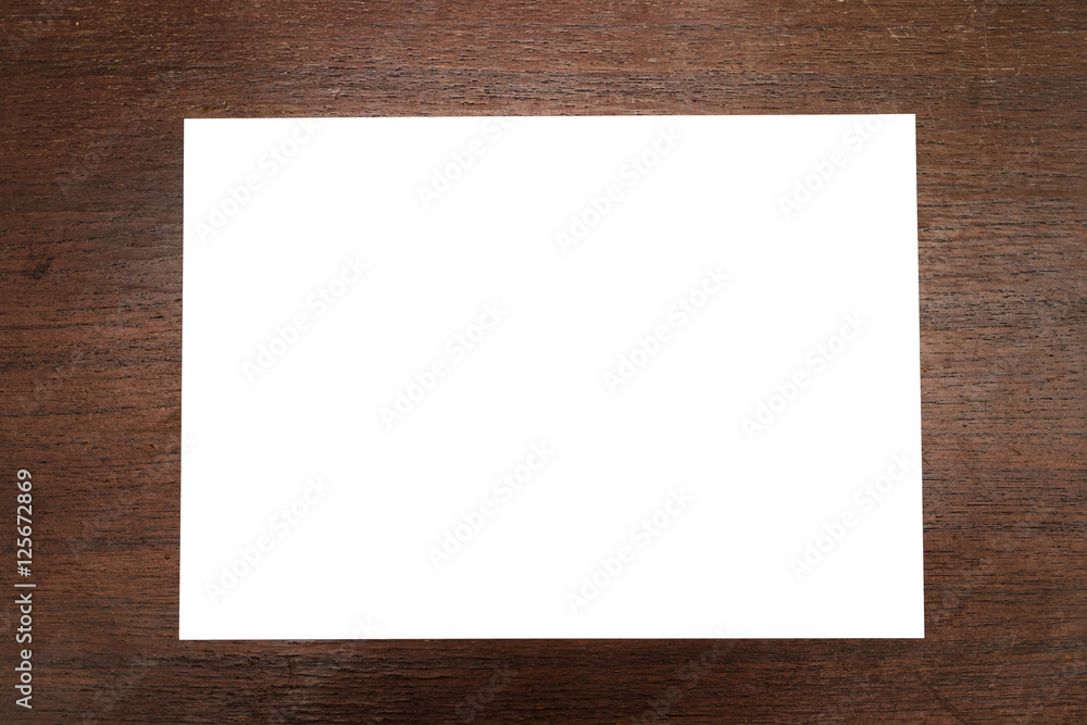 Blank paper fold on the old wood table. Blank paper fold on the old wood table.