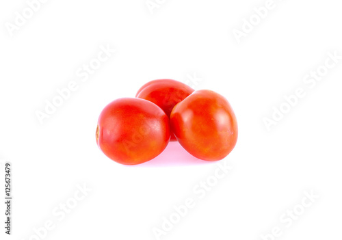 Three tomatoes isolated on white background © panor156