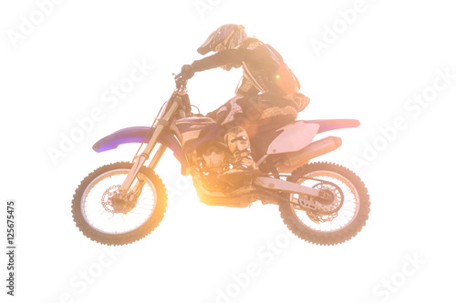 Motocross airbone isolated with sun flare on white background photo