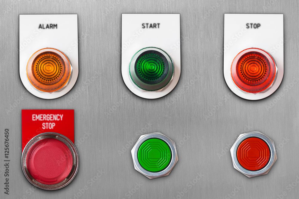 Push button switch with emergency stop and start stop alarm lamp signal on stainless steel panel wit clipping path