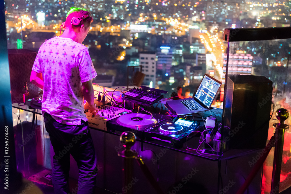 Obraz premium DJ - Party on top of building with music entertainment