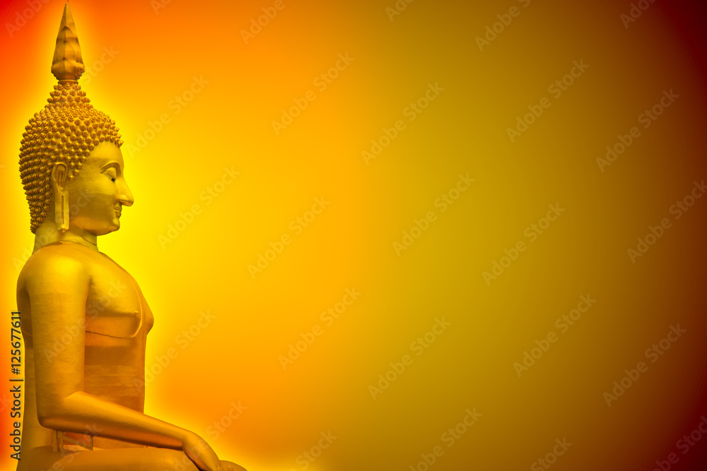 Golden Buddha glow light in dark with space for background or postcard or wallpaper design.