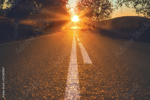 Country road under the sunset lights
