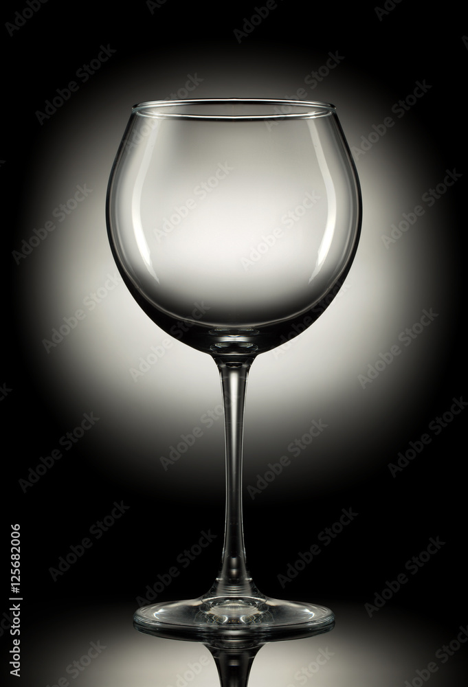 Empty wine glass on a color background. Empty wine glass on a color background.