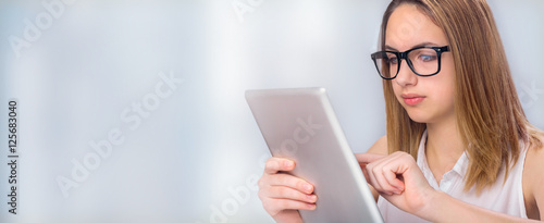 Young woman using tablet .
