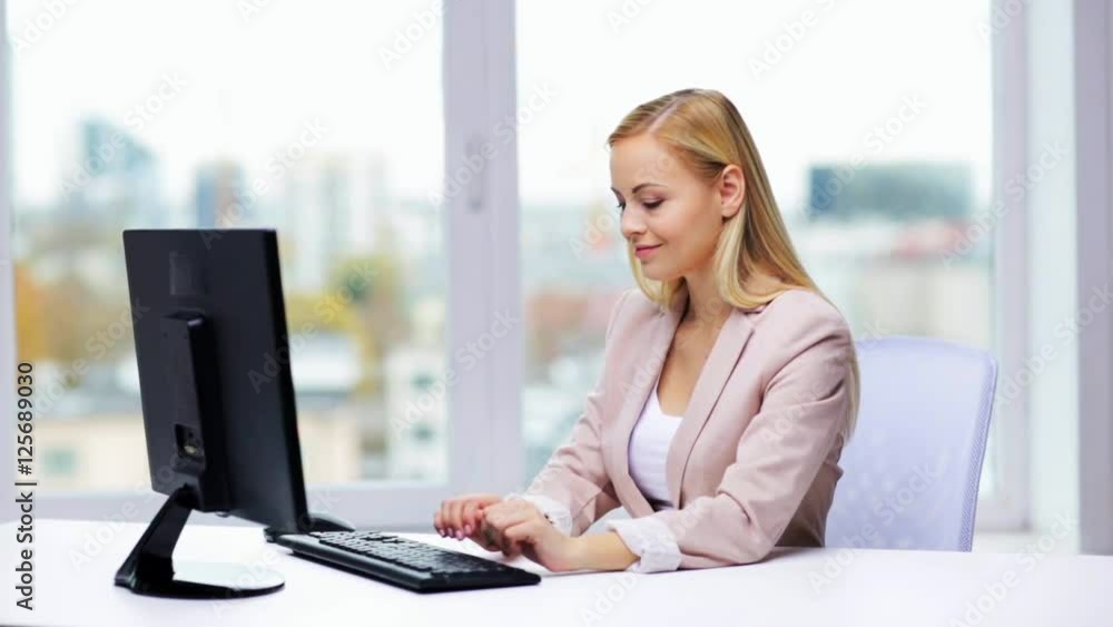 young businesswoman with computer typing at office young businesswoman with computer typing at office
