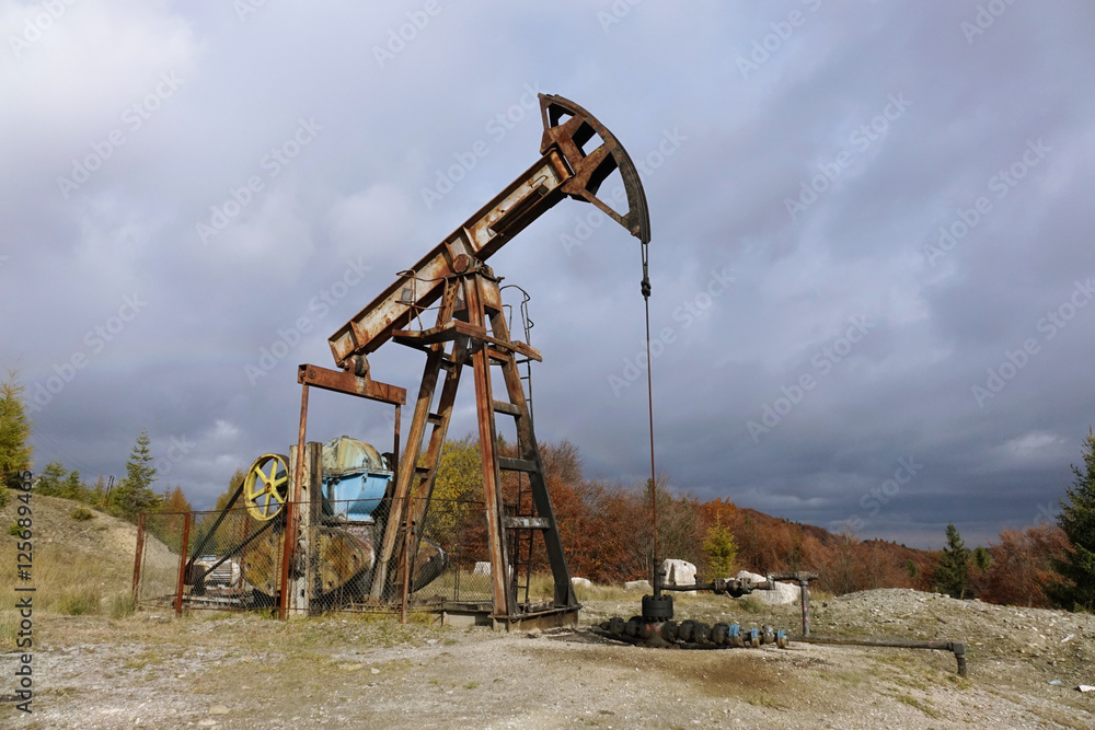 old oil pump in the Carpathian Mountains old oil pump in the Carpathian Mountains