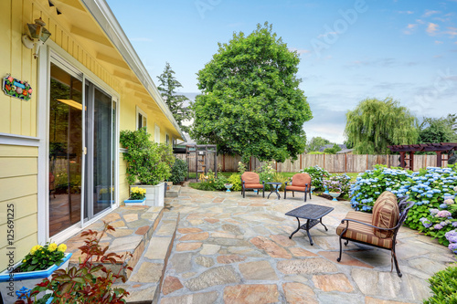 Well designed patio area with stone floor.