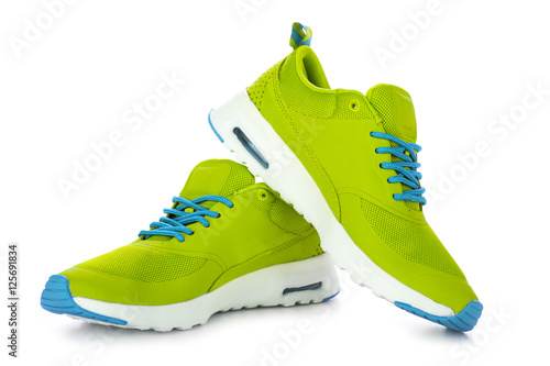 Green sport shoes isolated on white background