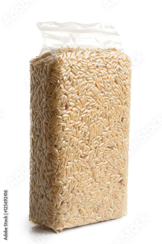 Vacuum packed long grain brown rice isolated on white.