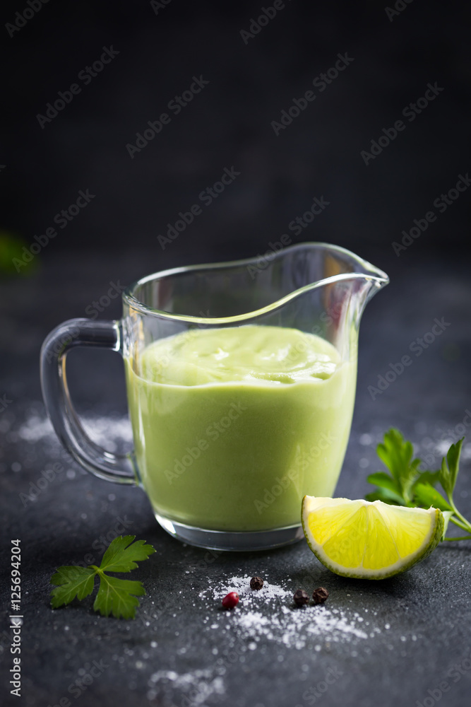 avocado salad dressing. Creamy avocado sauce in glass. avocado salad dressing. Creamy avocado sauce in glass.