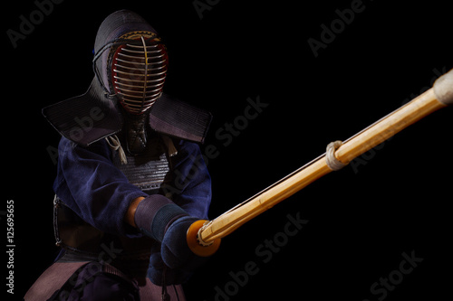 Obraz na plátně Portrait of man kendo fighter with bokuto