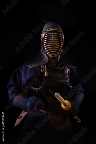 Portrait of man kendo fighter with bokuto