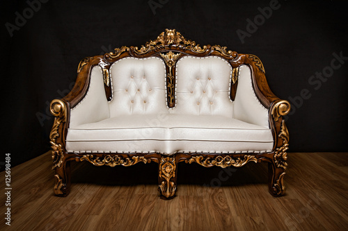 Antique white royal seat with ornaments
