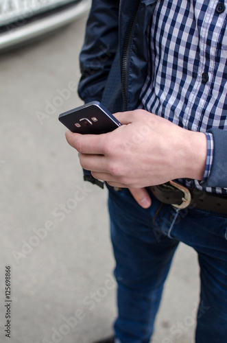 Young man using his phone