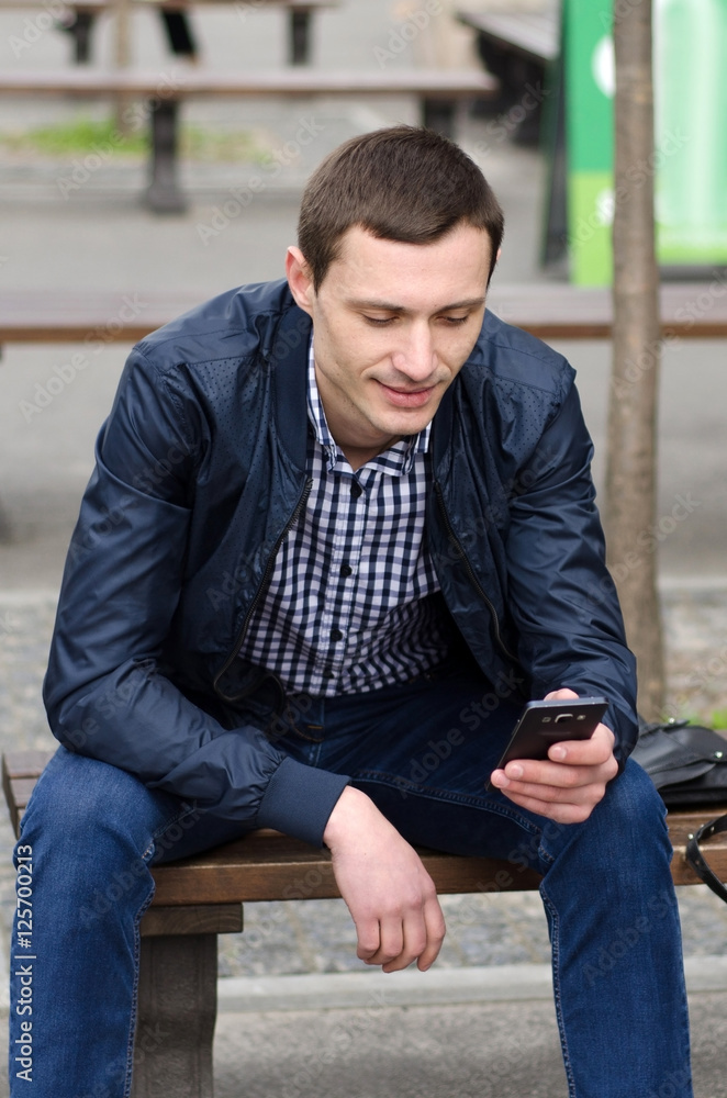 Young man using his phone Young man using his phone