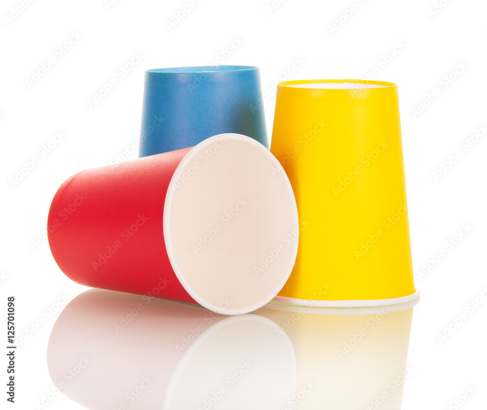 Bright disposable paper cups isolated on white. Bright disposable paper cups isolated on white.