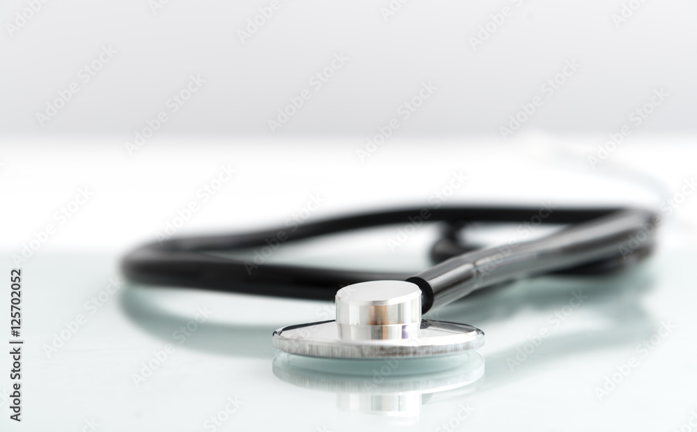 Close-up stethoscope on table with white background Close-up stethoscope on table with white background