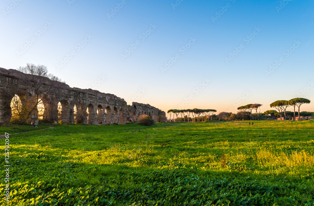 Rome (Italy), The Parco degli Acquedotti at sunset. - Parco degli Acquedotti is an archeological public park in Rome, part of the Appian Way Regional Park, with monumental ruins of roman aqueducts.