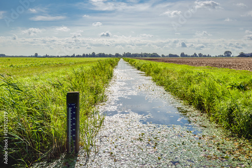 Water level tide gauge in a Dutch polder ditch photo