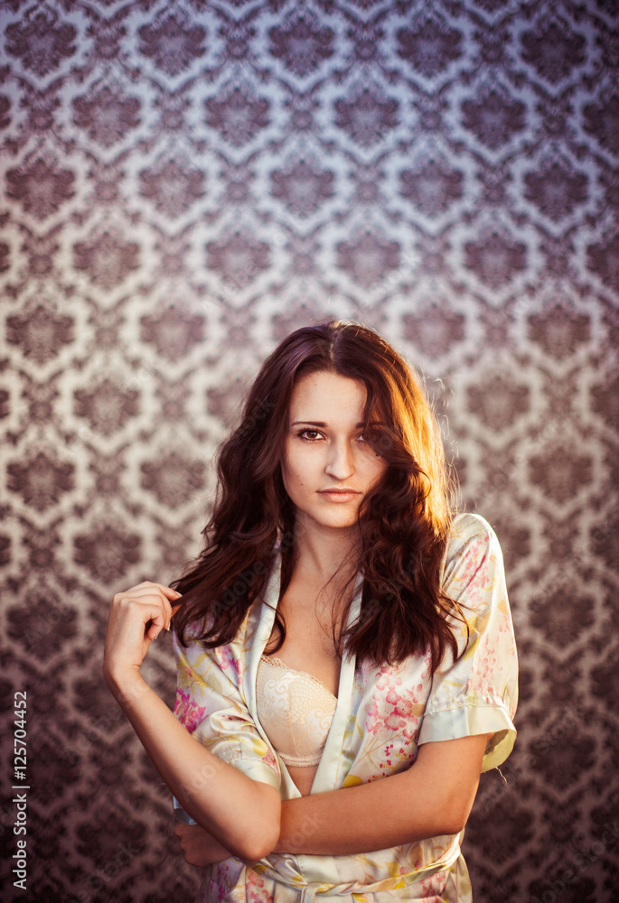 The tenderness bride stands in the center of room The tenderness bride stands in the center of room