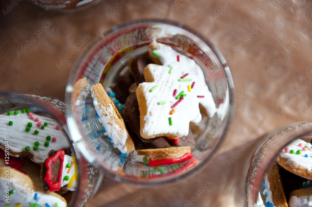 christmas cookies with icing in glass