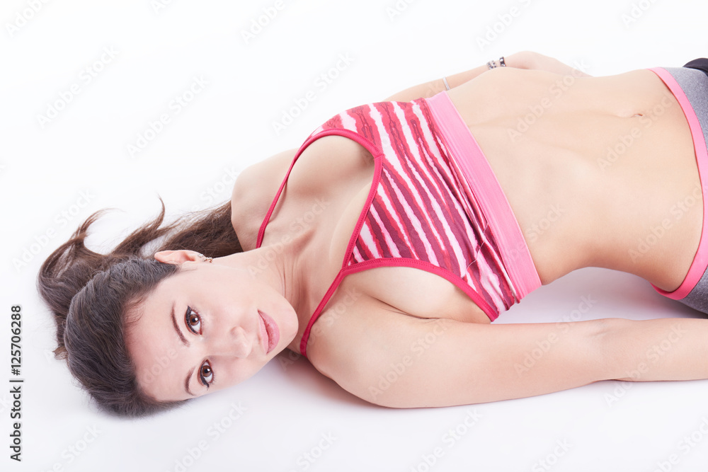 Smiling young woman relaxing after workout Smiling young woman relaxing after workout