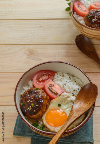 Japanese hamburg steak or Hambagu is a dish made of ground beef or pork seasoned with savory sauce. photo