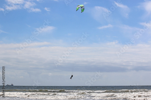 kitesurfer jumping in Waves