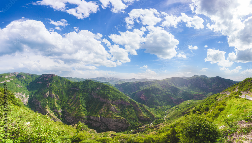 Beautiful landscape with green mountains and magnificent cloudy sky. Exploring Armenia