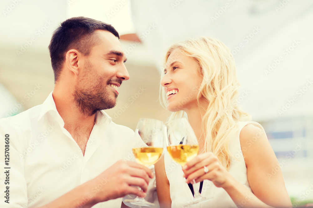 happy couple clinking glasses at restaurant lounge happy couple clinking glasses at restaurant lounge
