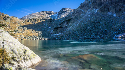 Fototapeta Naklejka Na Ścianę i Meble -  Beautiful Frozen Lake High In The Mountain