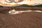 cracked earth near drying water on twilight at at Sam Pan Bok in Ubonratchatani Province.Thailand