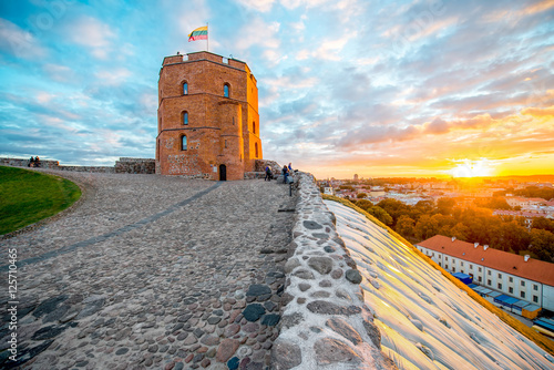 View on Gediminas tower on the castle hill during the sunset in the old town of Vilnius city in Lithuania. This tower is very popular tourist destination in Vilnius