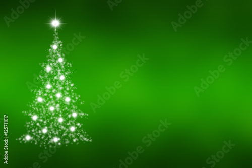 Christmas tree of snowflakes and sparkles on green background