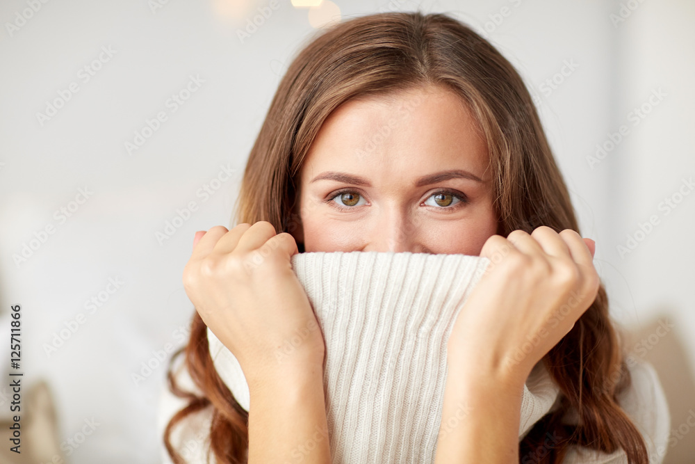 young woman or teen girl pulling pullover collar young woman or teen girl pulling pullover collar