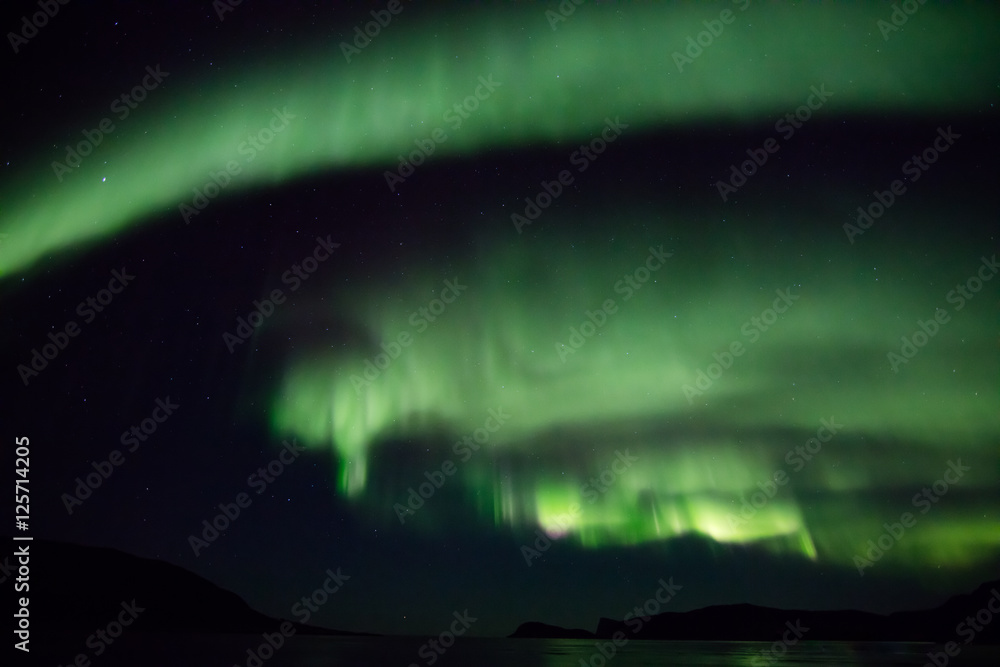 Aurora curls over Tromso
