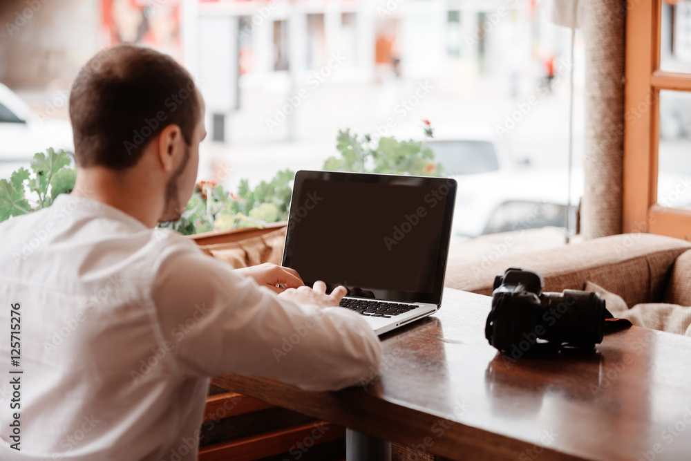 Man is looking at laptop with excitement. Man is looking at laptop with excitement.