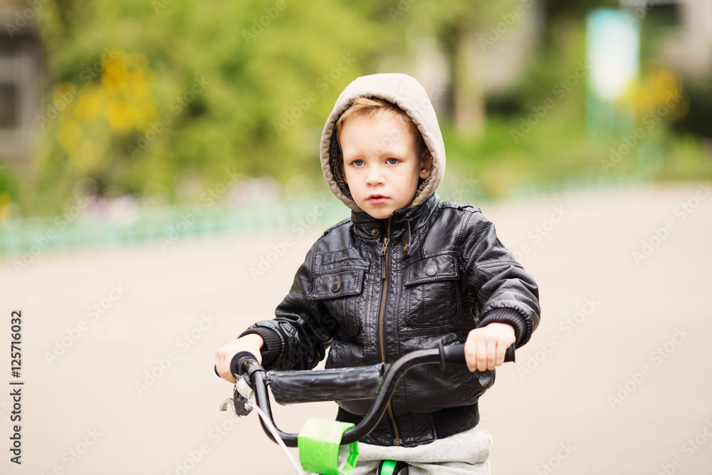 portrait of adorable little urban boy wearing black leather jack portrait of adorable little urban boy wearing black leather jack