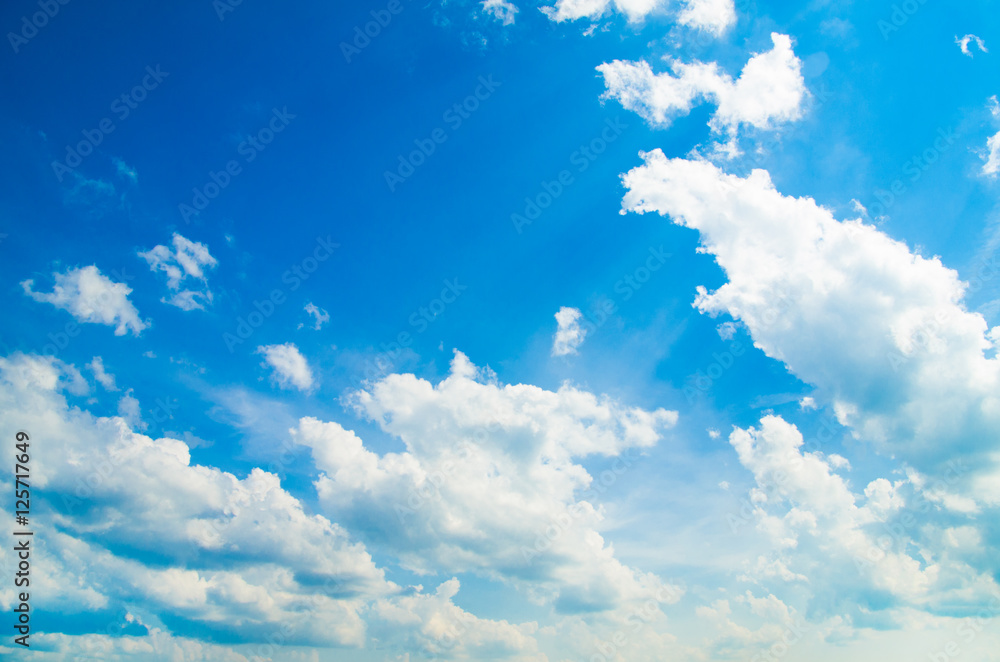 Obraz premium white fluffy clouds in the blue sky
