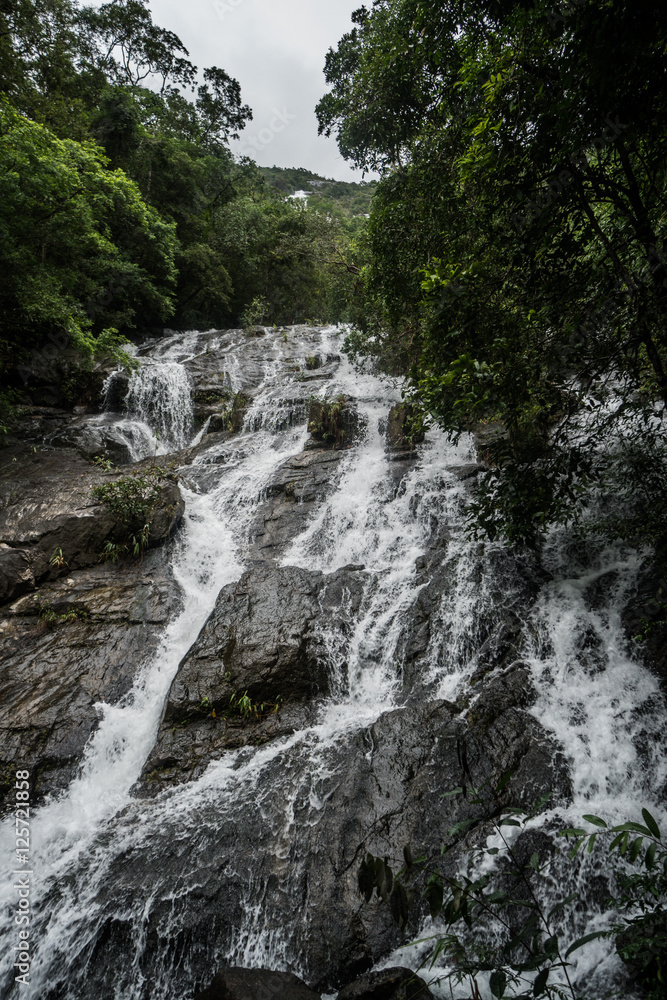 Closeup of beautiful waterfall in nature green tropical forest Closeup of beautiful waterfall in nature green tropical forest