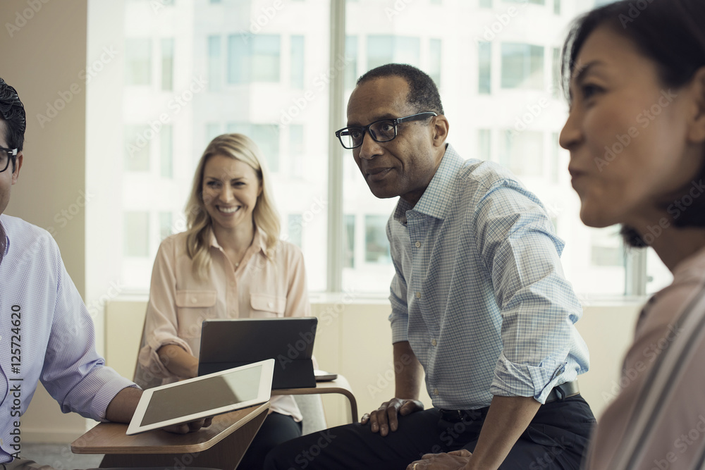 Business people in meeting having interesting discussion Business people in meeting having interesting discussion
